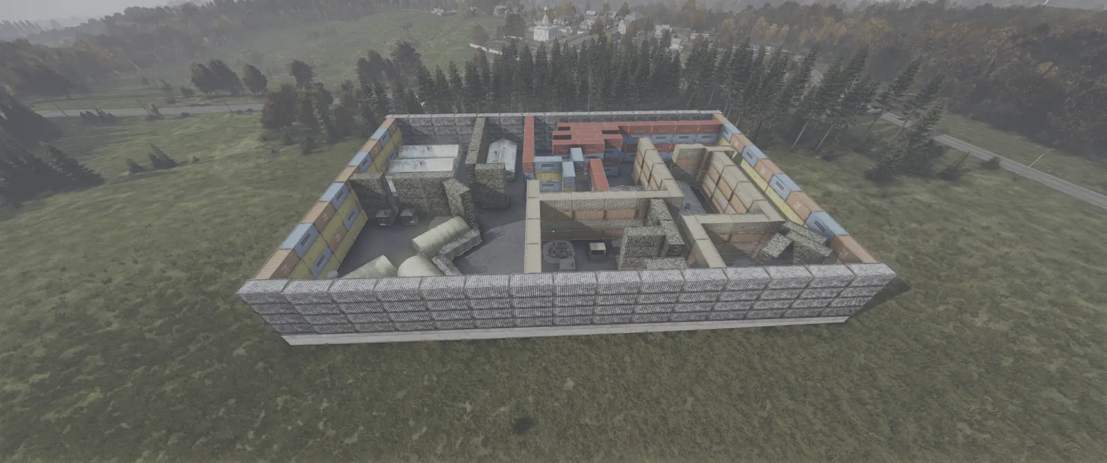 An aerial view of a zone walled with stacked shipping containers, built for solo, duo and trio players