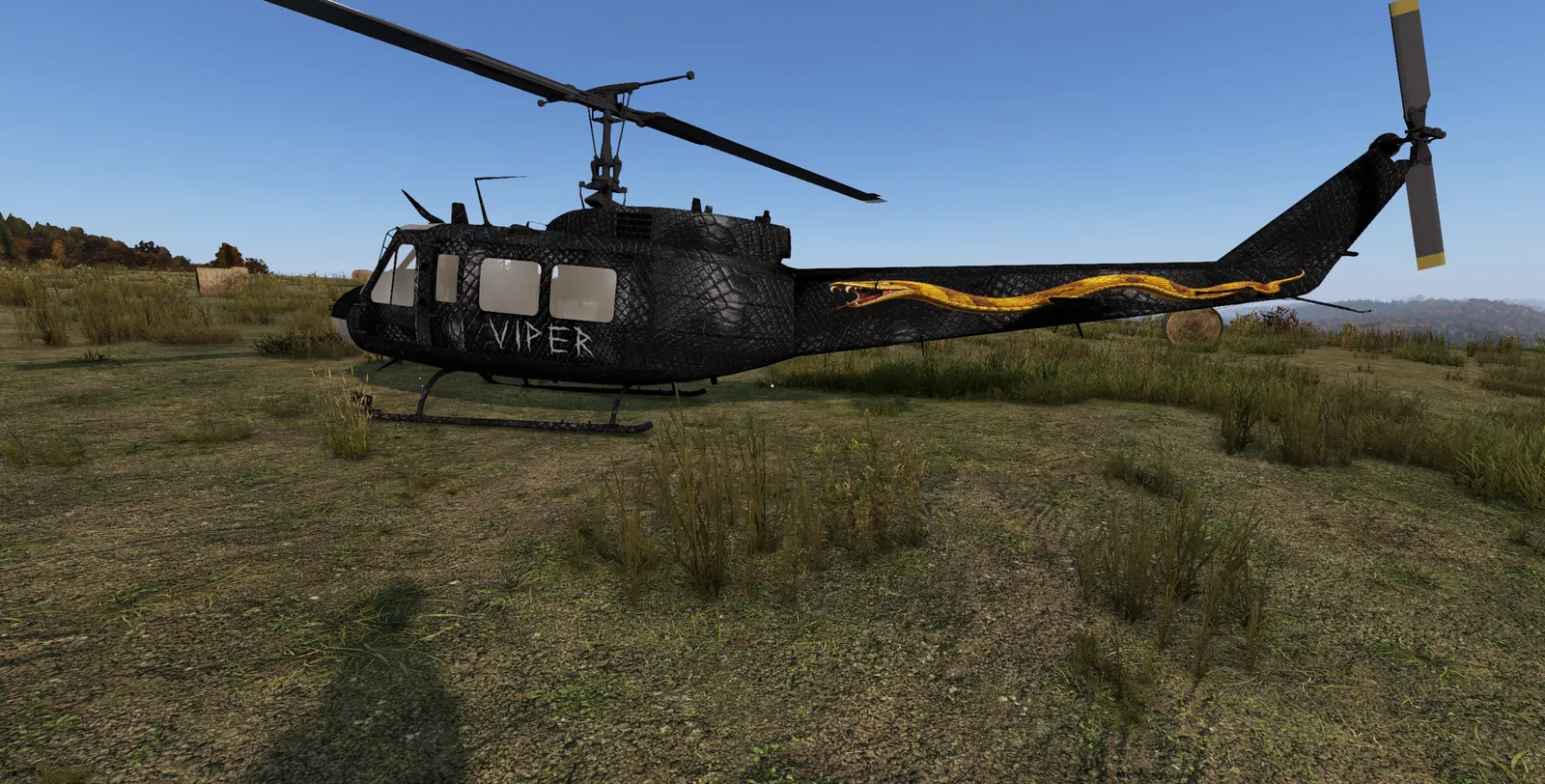 A black Huey with a snakeskin finish, a gold viper down the tail and VIPER painted on the side, a custom commission for a community member