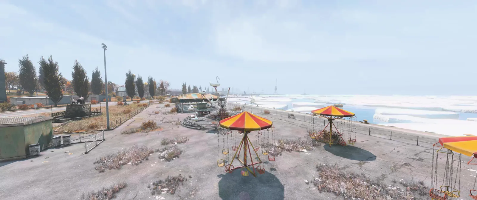 An abandoned fairground with carousels by the frozen sea on Sakhal