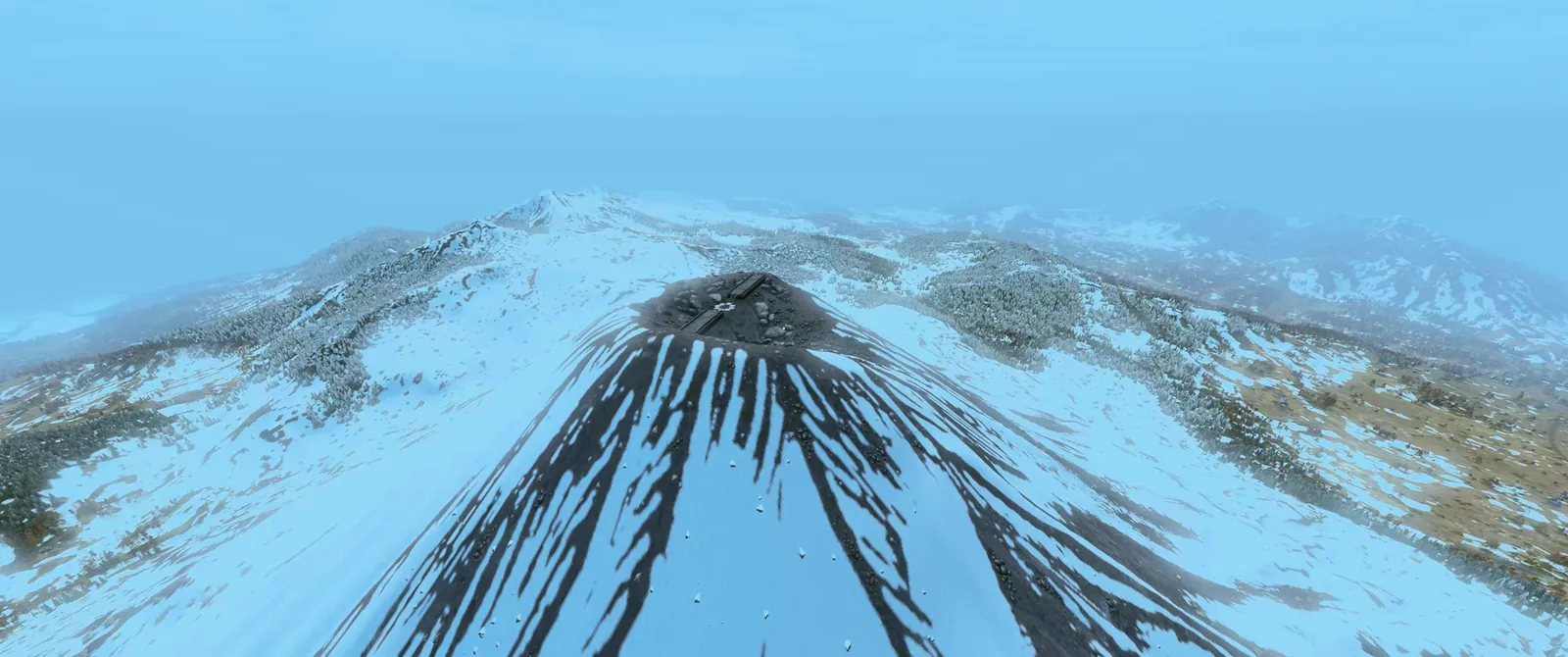 An aerial view of the snow-covered volcano on Sakhal